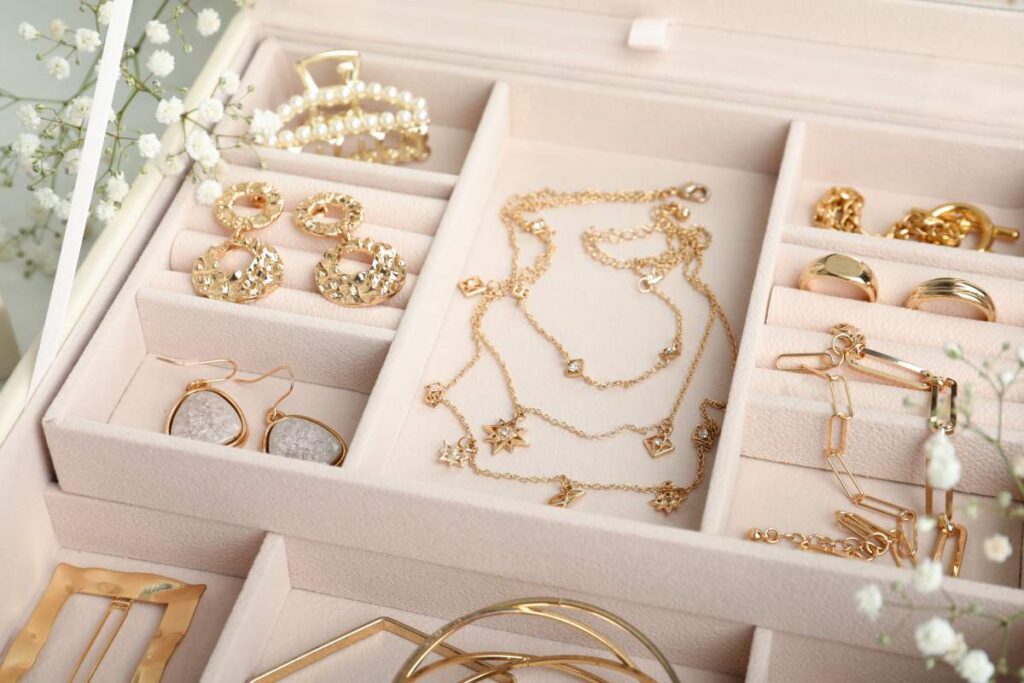 A person gently polishing a tarnished silver bracelet beside a soft cloth and jewelry storage pouch. KEYWORDS: ["silver jewelry polishing", "tarnished sterling silver", "jewelry storage pouch"]